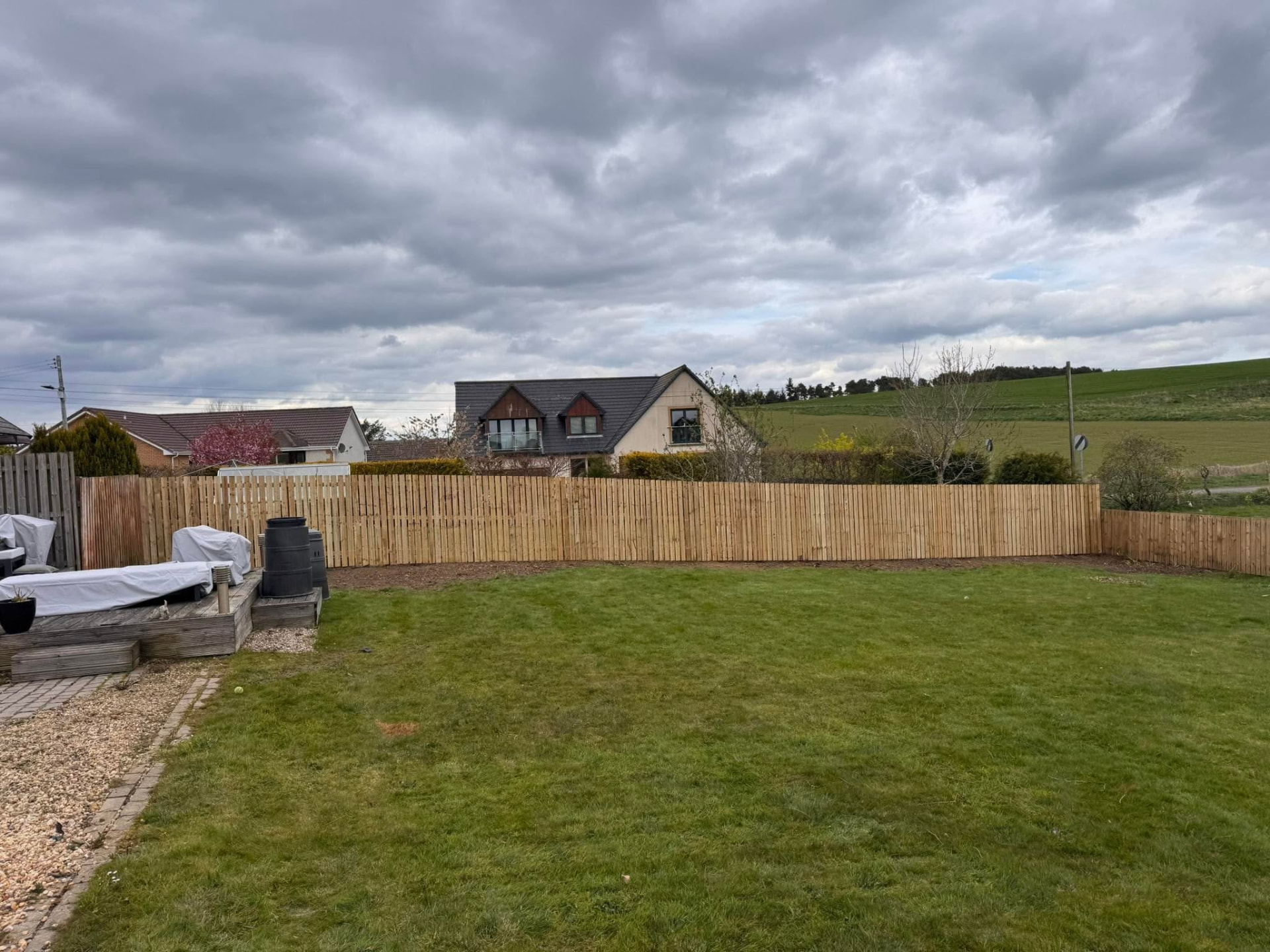 Completed close-board timber fence around a large rear garden